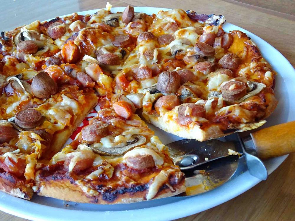 Pizza with hot dogs