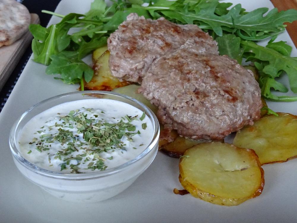Ground beef with tzatziki sauce and oven potatoes